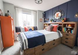 While andrew did the rolling. A Modern Navy Orange Nautical Kids Room Makeover The Diy Mommy Boy Bedroom Design Boys Bedroom Grey Boys Bedroom Makeover