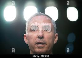 Lt. Gen. Stephen N. Whiting, Space Operations Command Commander, presents  challenge coins to Clear Space Force Station Arctic Airmen and Guardian  superior performers in their duties to protect and defend the homeland.