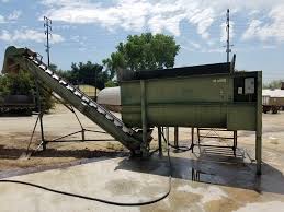 Mixing cob or earthen plaster with a cement mixer. Soil Mixing Agricultural Operations