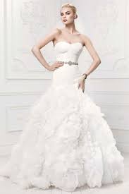 Lace sleeves on wedding dresses are nothing new, ever since a certain ms middleton got hitched in sarah burton for mcqueen, but lengths vary for summer 2014 as seen at: The 25 Most Popular Wedding Gowns Of 2014 Bridalguide
