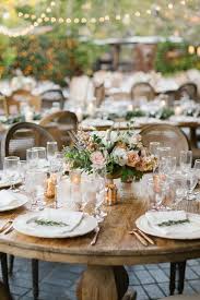 This Bride And Groom Made Most Of Their California Wedding S Decor And Were So Good They Started A Design Company Round Wedding Tables White Floral Centerpieces Wedding Table