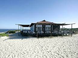 The 8 Best Beachside Cafes In The World Portugal Beach Portugal Travel Hotels Portugal