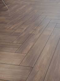 The plank style tile is one of the most popular looks today and it looks like it is here to stay. Herringbone Wood Effect Floor Tile Walnut Herringbone Flooring