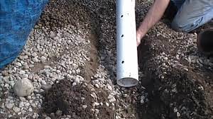 Designing and installing piped drainage systems is a monumental task and should only be handled by certified landscapers. How To Install Perforated Pipe French Drain For Do It Yourself Job Youtube
