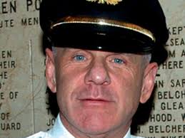 Strapped town axes top cop