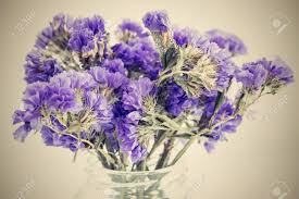 Small purple flowers in bouquet. Dry Bouquet From Abstract Small Violet Flowers On An Empty Background Closeup With A Retro Effect Stock Photo Picture And Royalty Free Image Image 43387339