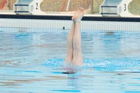 Coach Eli showed that hard times won't stop her from giving a strong  performance at competition at Eastern's last weekend! She ended her time as  a swimmer