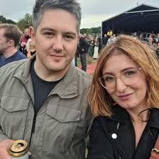 This baby Goldfinch was sitting at our back door. It was tiny. I zoomed the  picture in.