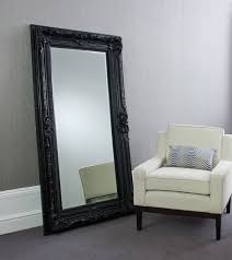 Inside each apartment, the luxury amenities continue. Living Room Black Floor Mirror Novocom Top