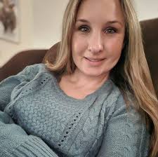 Last night's Christmas program in Grapeland, Texas, was graced by the  presence of the Anderson County Choir. And who did I spy among the  carolers, but this group's fearless leader?!