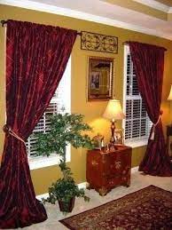 Design ideas for a small contemporary open concept family room in paris with yellow walls, light hardwood floors, no fireplace and beige floor. Curtains For Gold Walls Burgundy Living Room Gold Living Room Formal Living Rooms