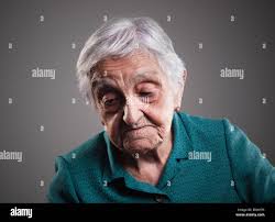 Mature woman looking down isolated hi-res stock photography and images