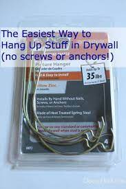 Easy Tip To Hang Up Items On Drywall And Sheetrock And No Tools Screws Or Anchors Required Hanging Heavy Pictures Hanging Pictures Drywall