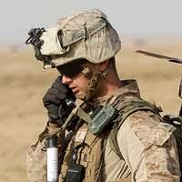 US Navy 031018-N-4055P-011 Lance Cpl. Leighton Becker talks with teammates  over the radio