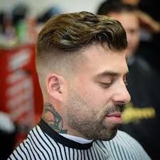 Zero Fade On A Wavy And Messy Slicked Back Design Slicked Back Undercut Hairstyles Undercut Styles
