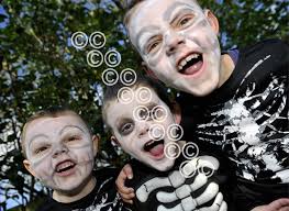 26250711-Crookston Castle Pr teacher Sarah-Jane Caldwell with the pupils  from her school who worked in the book Droopy Discovers Europe. Sarah Jane  and Demi Sheldon 9 have a close look at the