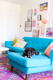 Soft blue paint, sand, and stone colored fabrics and driftwood accents combine seamlessly to make an afternoon in this living room feel like a day at the beach. Colors That Go With Blue Best Blue Complementary Colors Apartment Therapy