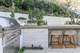 So whether you're buying your outdoor island from us, or building your own, you'll find. White Brick Outdoor Kitchen With Concrete Countertop Transitional Kitchen