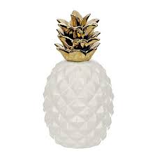 Add some modern twist into old and boring fruit sculptures with this small, white, and gold ceramic pineapple home decor! White And Gold Pineapple Figurine Kirklands