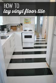 The tile need to be installed over clean and sleek surface. How To Lay Vinyl Black And White Flooring In Stripes Budget Flooring Ideas Black And White Flooring Kitchen Flooring