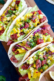 These fresh ahi tuna fish tacos with smoky adobo crema & crunchy red cabbage coleslaw. Ahi Poke Tacos With Pineapple Mango Pico Recipes Fish Recipes Food