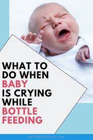 What To Do If Your Baby Cries While Bottle Feeding Baby Crying Bottle Feeding Newborn Bottle Feeding