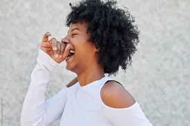 Buy black woman laughing and smiling with tablet by rocketclips on videohive. Carefree Young African American Woman With Curly Black Hair Laughing Out Loud While Standing Alone Outside Women Laughing African American Women American Women