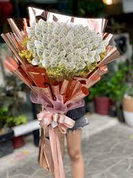 Each bouquet is hand folded using crisp new money. Money Bouquet Money Bouquet Money Flowers Gift Bouquet