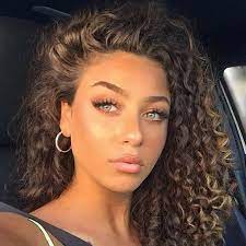 Portrait of beautiful young woman with gray eyes and long straight brown hair, nice smile, light makeup, wearing jewelry, wearing a colored blouse, sits alone at a table. Light Skin Girls With Brown Curly Hair Novocom Top