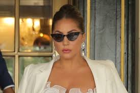 Lady gaga in a revealing outfit at the 2017 grammy awards. Lady Gaga Goes Glam In A Romantic White Gown Coat Silky Satin Heels Footwear News