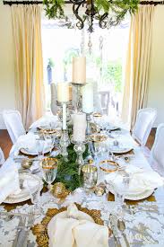 This elegant christmas dinner has a dressy but approachable atmosphere featuring a neutral palette of golds, silvers, and creams and emphasizing texture. Elegant White And Gold Christmas Dining Room And Table Scape