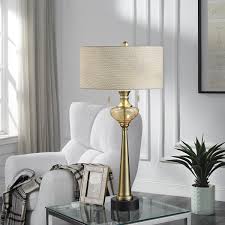 Several bold features, including a large geometric base and a sleek cylindrical hardback shade, give this gold table lamp a striking appearance. Stylecraft Goldwine Gold And Silver Glass Table Lamp Off White Shade Overstock 22303008