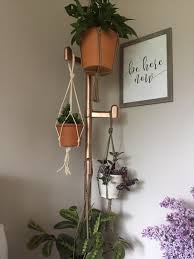 It's nice to compliment your interior with greenery, but are potted plants. Apartment Plant Hanging Hacks I Can T Make Holes My Walls Or Ceilings So I Bought This Coat Rack Off Amazon And Spray Painted It Rose Gold It S Quite Sturdy And Does The