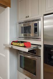 If you've faced this problem, you can easily solve. Custom Stainless Steel Pull Out Shelf Serves As Perfect Landing Space Below A Microwave Designed By Custom Built Kitchen Cabinets Home Kitchens Kitchen Design