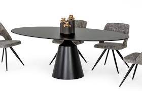 A great transitional round dining table that easily extends to an oval for 6 settings. Modrest Edith Modern Oval Black Ceramic Dining Table