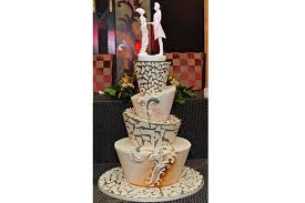 A beautiful purple ombre wedding cake with chocolate drip, fresh berries and blooms is stylish for halloween. The Spookiest Halloween Themed Wedding Cakes