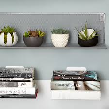 Add extra storage or introduce a decorative element to your living spaces with floating shelves in different styles and sizes. Floating Bookshelf Umbra Conceal Book Shelves The Container Store