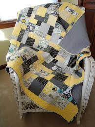 After seeing a yellow and gray quilt i posted on facebook, sara wanted a quilt with those fabrics also. Modern Gray And Yellow Baby Quilt Baby Quilts Quilts Yellow Quilts