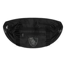 The raiders logo has had 5 different logos in their history, but 3 of the logos are the same continuing design that moved from oakland to los angeles and back to the created logo for their newly minted raiders, a pirate wearing a football helmet with an eye patch on a gold football background. Las Vegas Raiders Logo All Black Waist Bag New Era Cap
