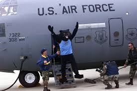 The 460th Air Base Wing (ABW) team mascot Buck Lee, from Buckley Air Force  Base (AFB), Colorado (CO), enthusiastically leaps from the aircraft steps,  after arrival at Vandenberg Air Force Base (AFB)