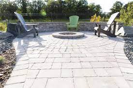 Foto de piscina tradicional, de tamaño medio, rectangular, en patio. Custom Circle Fire Pit Inlaid In A Roman Paver Patio Outdoor Fire Pit Paver Patio Backyard Patio