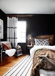 The men's bedroom wall decor brings decorative details related to their hobbies, and for the furniture, it is always with rough finishes, solid, strong and linear. Cool Masculine Bedroom For Mens Black Wall Decor And White Rug And Curtain Modern Rustic Bedrooms Home Decor Bedroom Rustic Master Bedroom