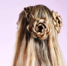 Low bun with twisted braids. In Bloom 10 Flower Hairstyles We Re Gushing Over Now