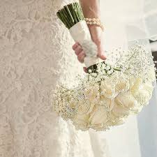 White roses flowers wedding bouquet. Wedding Bouquet With White Roses Tucked In A Bed Of Baby S Breath I Husi Bloma Flower Delivery Shop Iceland
