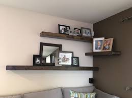 Diy Rustic Floating Corner Shelves Perfect For Above The Couch The Alternating Wall Look A Living Room Shelves Wall Decor Living Room Floating Corner Shelves