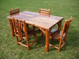 Rustic Log Sassafras Table And Chairs Set Walnut Top Provides For A Great Formal Or Rustic Kitchen Tables Rustic Wood Kitchen Tables Rustic Outdoor Furniture