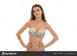 Young beauty brunette woman with big natural breasts in swimsuit with  floral pattern looking at the camera isolated on white background Stock  Photo by ©ponomarencko 143150459