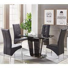 What kind of wood is kaminly small dining table made of? Memphis Glass Dining Table Small In Black With 4 Dining Chairs 649 95 Go Furniture Co Uk