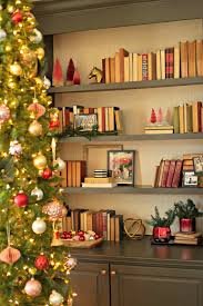 Scale down with a small tree. Christmas Bookshelf Styling Tips