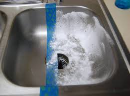 a stainless steel sink made shiny and